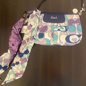 Coach Blue wristlet with ribbon.